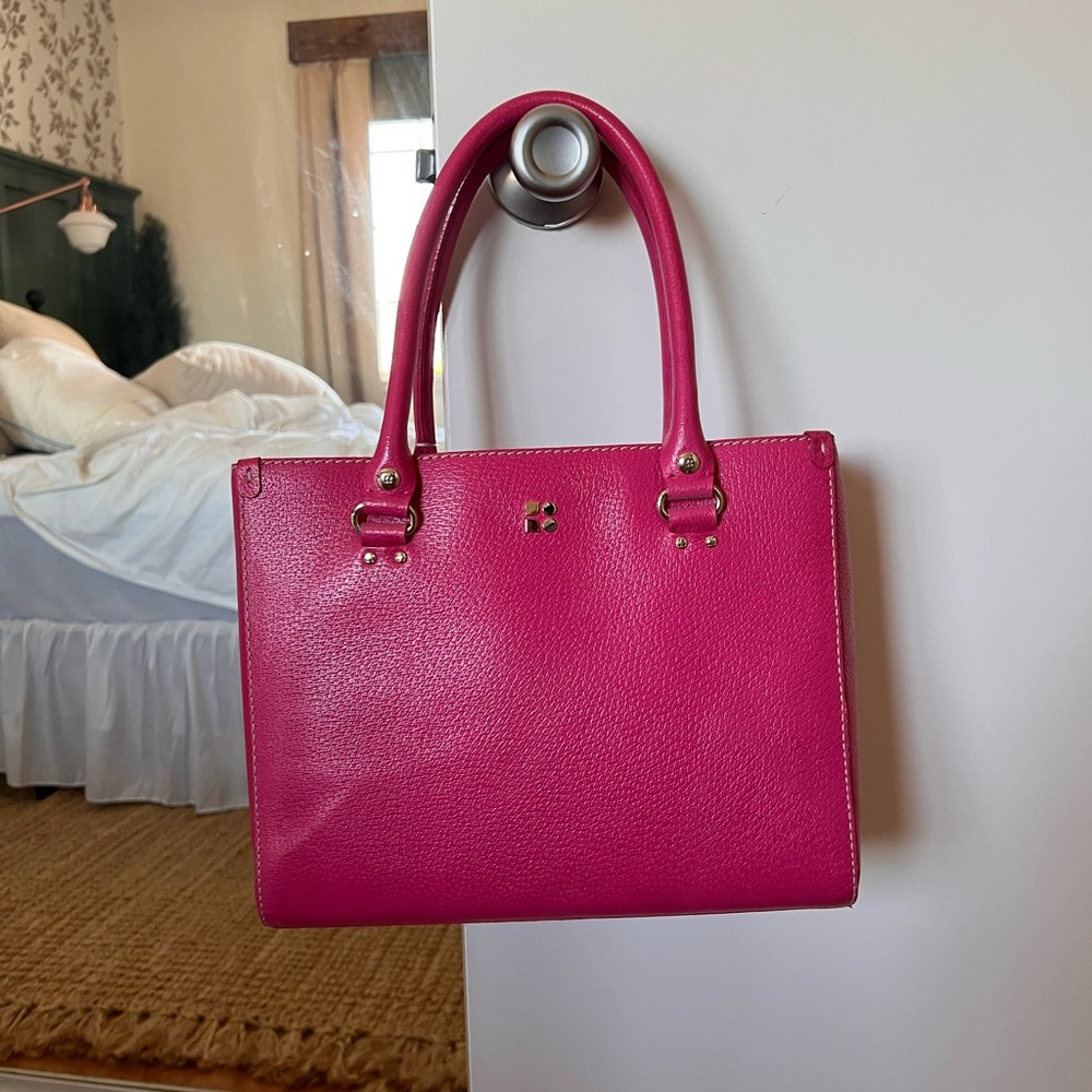 Hot pink Kate Spade purse with white stitching